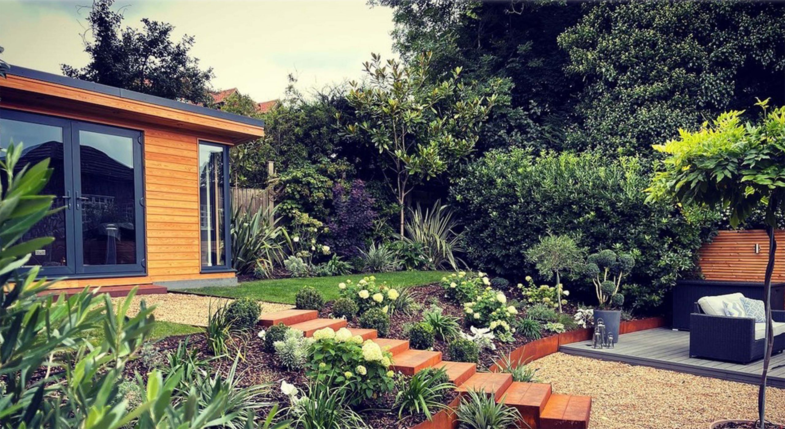 Designer garden with a bespoke garden building