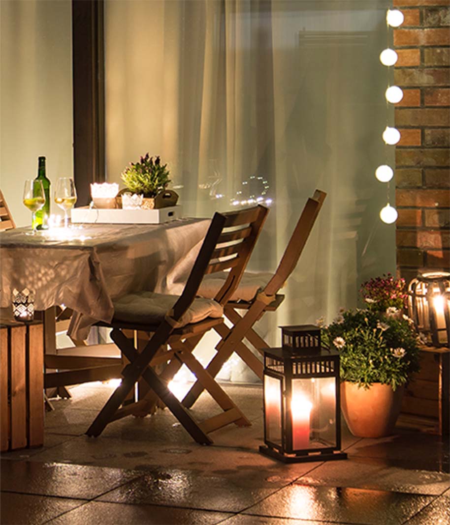 Fairy lights surrounding an outdoor patio at night