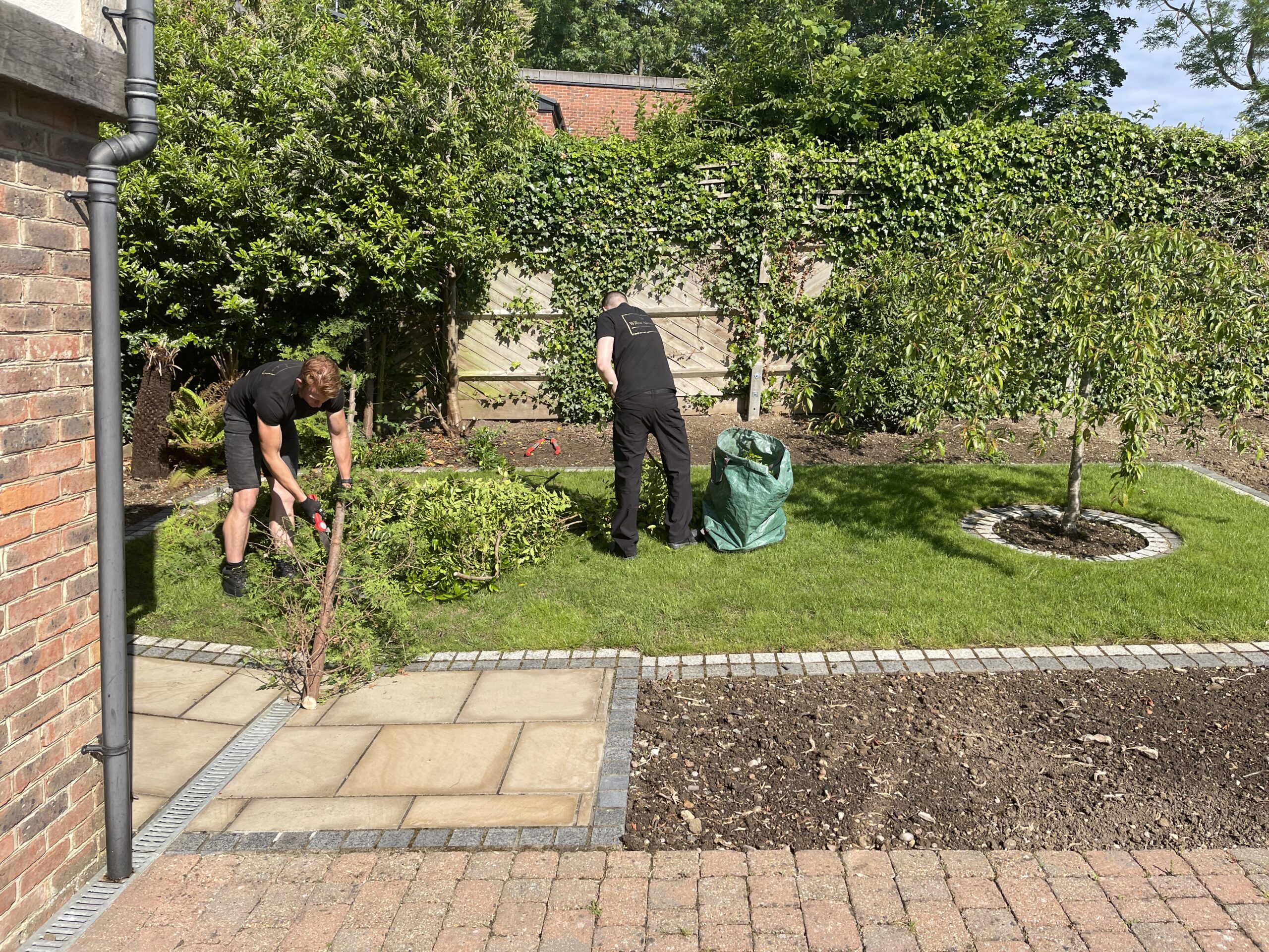 The Willow Alexander Garden maintenance team tending to a garden for a job